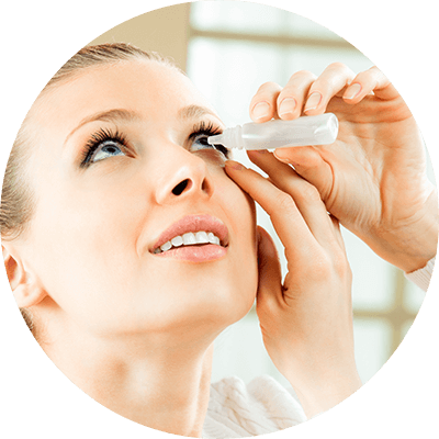 Woman Applying Eye Drops