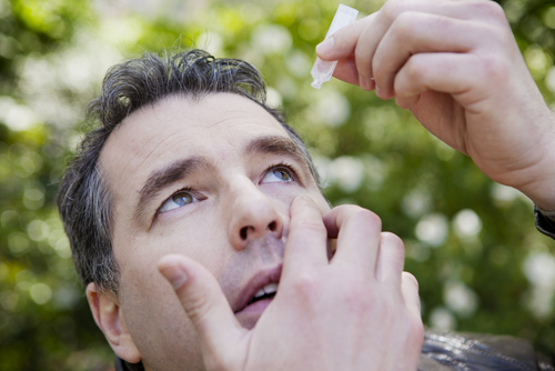 Man Using Eye Drops for Dry Eye