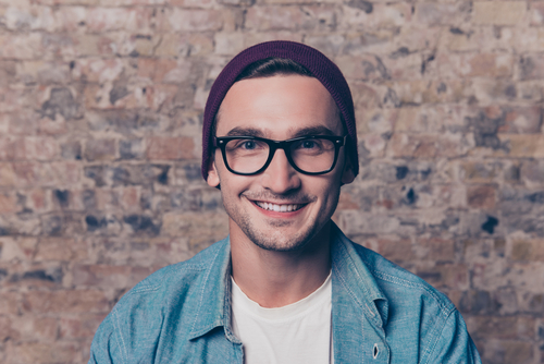 Smiling Young Man with Glasses