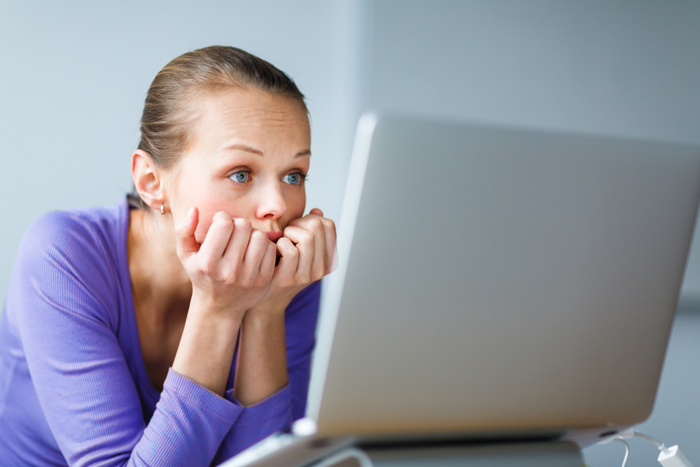 Woman with Tired Eyes Staring at Computer Screen