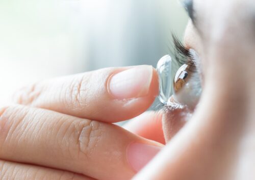 Person Inserting Eye Drops