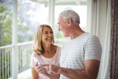 Happy Older Couple Viewing Phone
