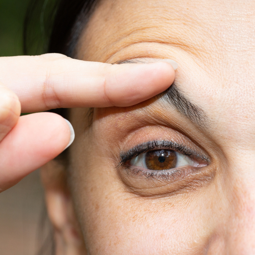 Close up of person measuring eyelid
