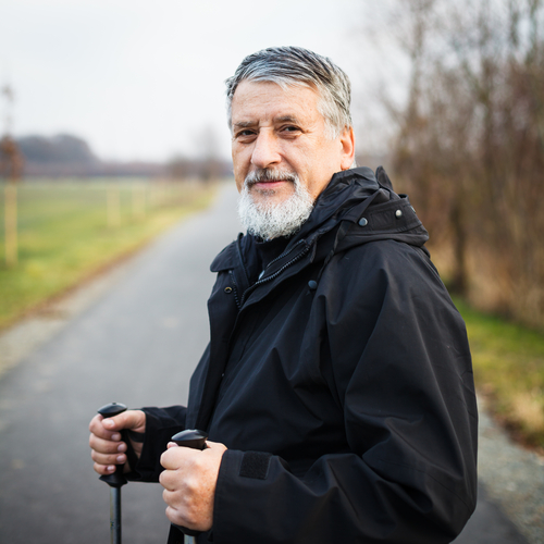 Senior man with walking sticks